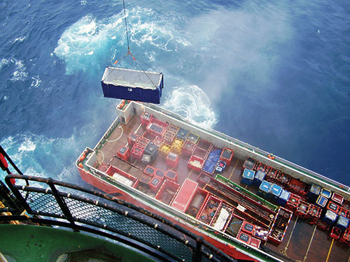 10Sparrows crane operators offloading cargo from a supply vessel