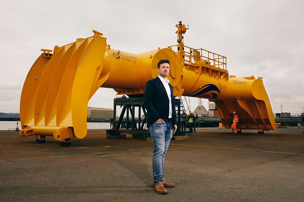 Mocean Energy’s Managing Director Cameron Mcnatt  With Mocean Energy'S Blue X Wave Energy Converter At Forth Ports’ Rosyth Docks.