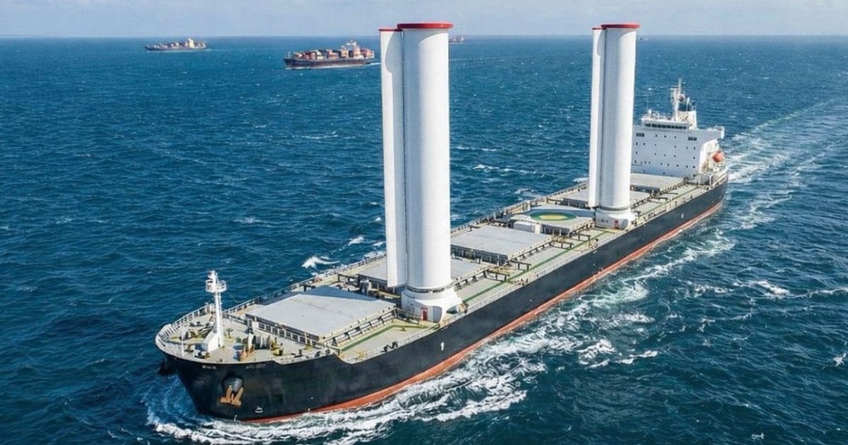 Cargo ship with rotor sails at sea