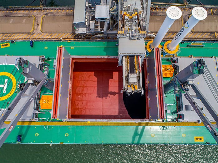 Anemoi Rotor Sails Marks Major Milestone for Wind-Assisted Propulsion 3 Aerial View Of M/V Afros During Cargo Operations, Showing Two Anemoi Rotor Sails Positioned Clear Of The Open Cargo Hold.
