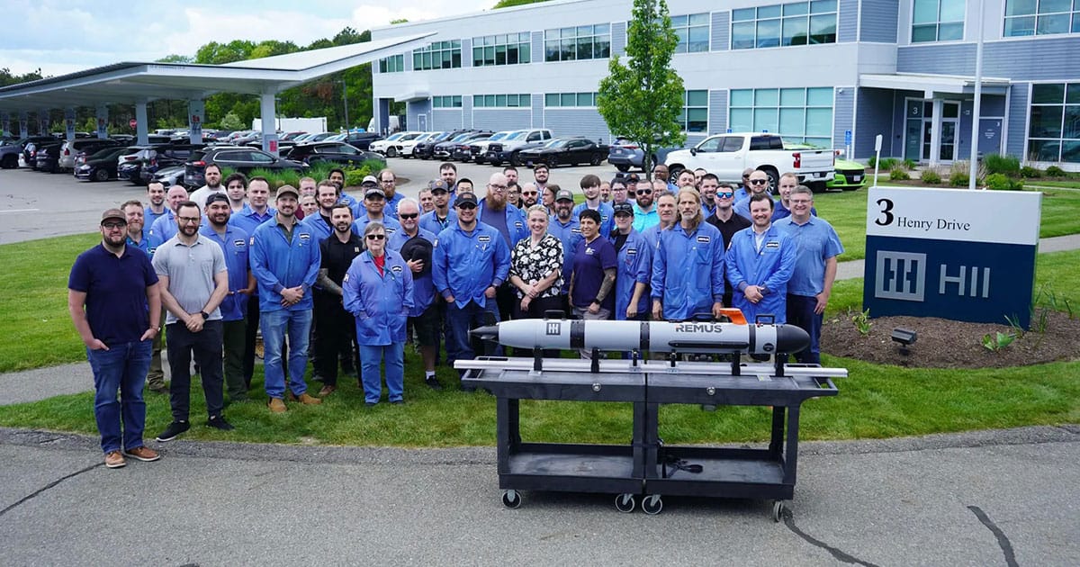 Employees of HII’s Unmanned Systems group pose outside HII’s facility in Pocasset, Massachusetts, with the first REMUS 130 unmanned underwater vehicle delivered to a U.S. ally. The delivery marks a major milestone for the next generation of the world’s most widely deployed autonomous underwater vehicle.