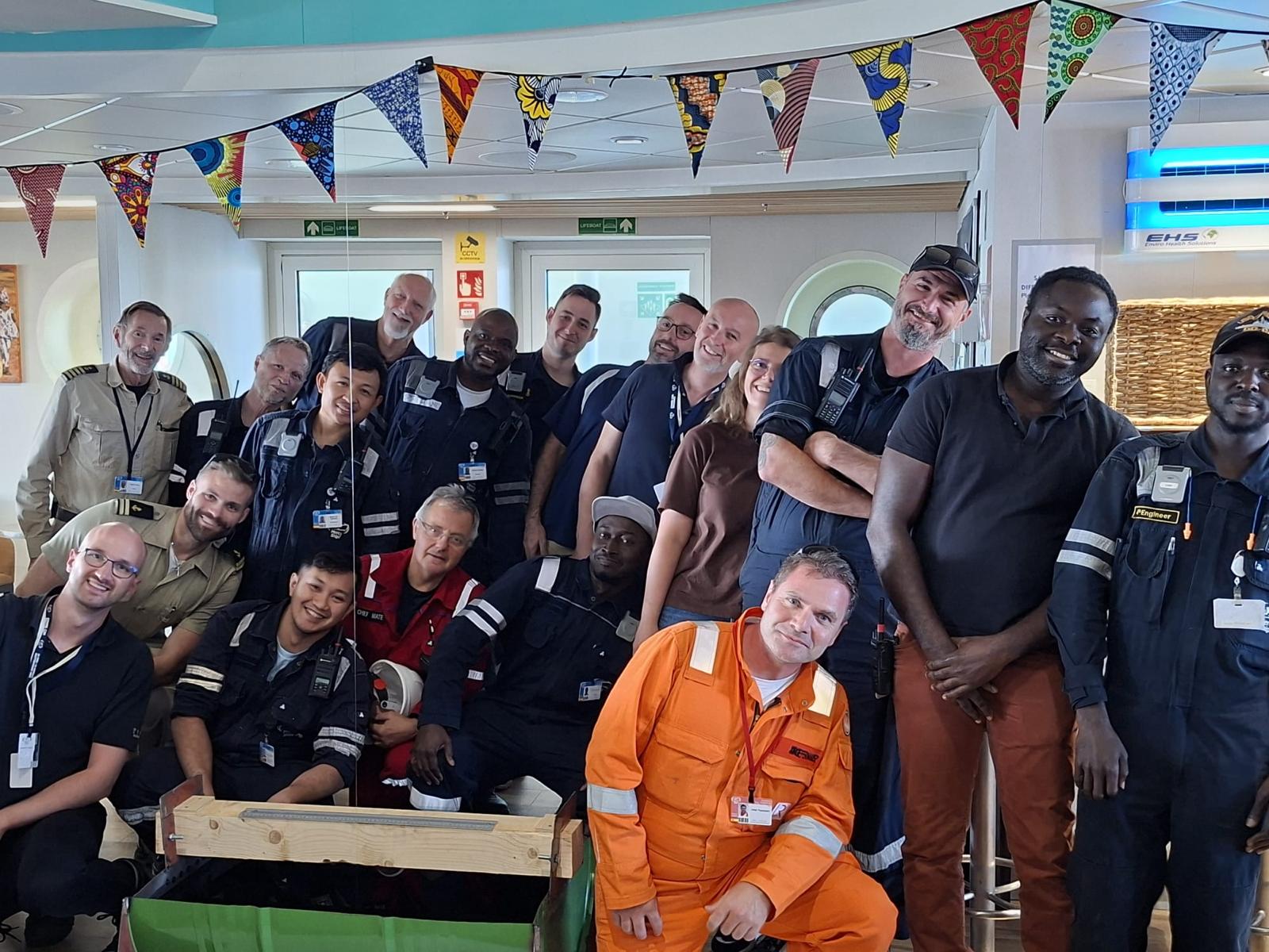 Tymor Marine Delivers Digital Inclining Test for Global Mercy 1 The Tymor Marine Team With Crew Members Aboard The Global Mercy Following Completion Of The Lightweight Survey And Inclining Test. Pictured Are Principal Naval Architect Niall Maclennan (Front Row, Seated, Left) And Managing Director Kevin Moran (Standing, Eighth From Left). (Image Credit: Tymore Marine)