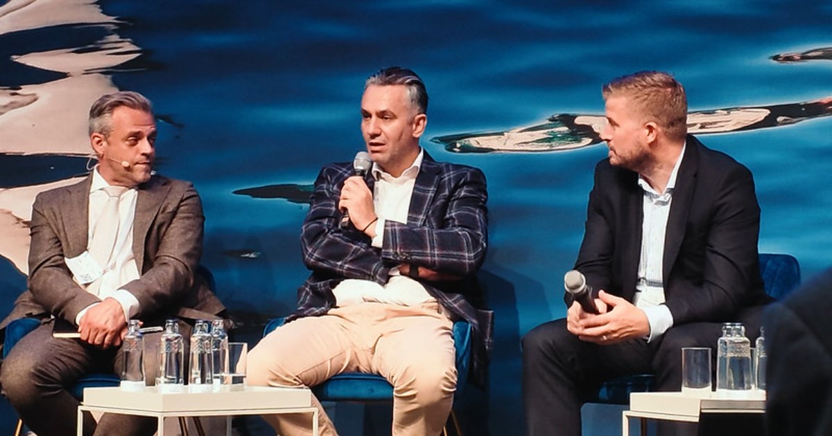 Philippos Ioulianou (center), EmissionLink Managing Director, speaking on panel at SMM Hamburg. (Credit: EmissionLink)