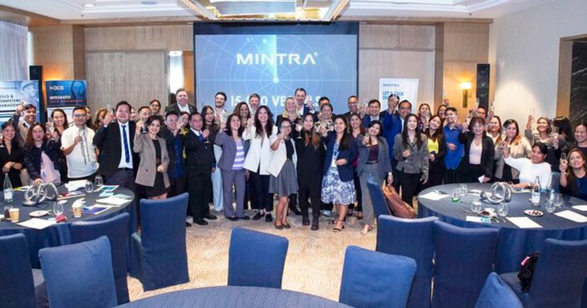 Mintra team toasting to celebrate the 15,000 Vessel Milestone at Mintra’s Manila Forum event. (Image credit: Mintra)
